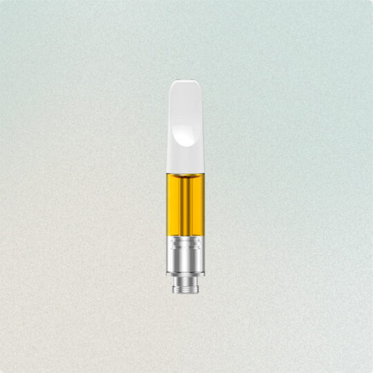 A vape cartridge filled with golden oil against a light background.