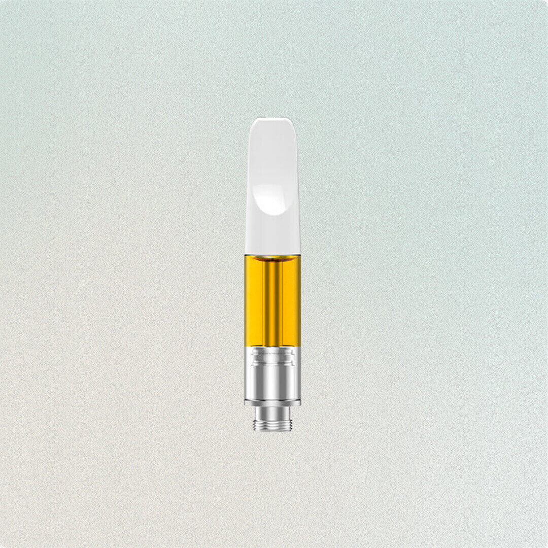 A vape cartridge filled with golden oil against a light background.
